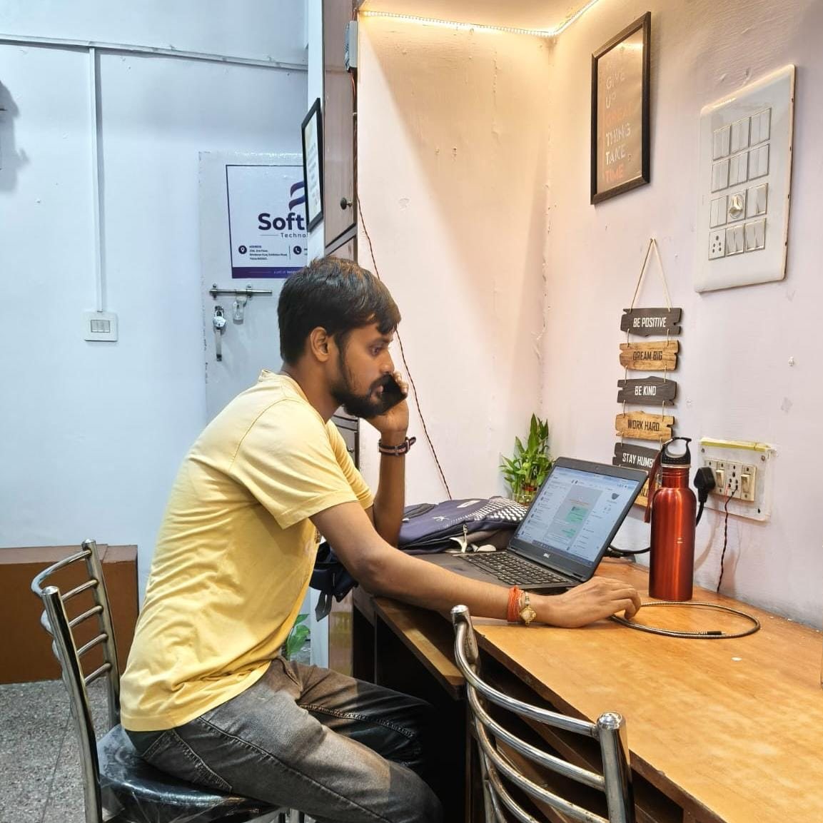SoftFYR team member working at a desk in the office